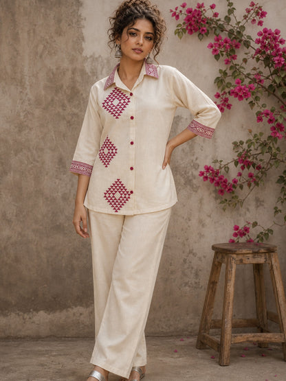 Vibrant ivory hand block print shirt featuring geometric motifs, magenta accents, and a contemporary silhouette inspired by traditional craftsmanship.