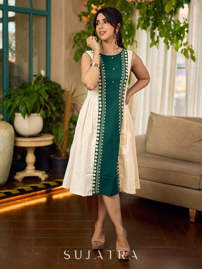 Bottle green and off-white hand block printed sleeveless dress with a block printed geometric panel, pearl embellishments, and refined accents for a contemporary artisanal look.
