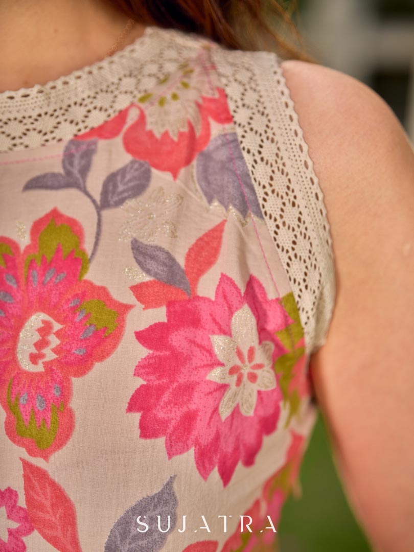 Cheerful off-white halter-neck dress with blooming floral prints and charming lace accents throughout