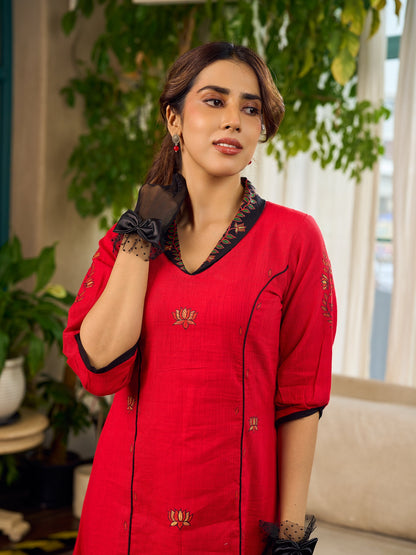 Elegant red dress featuring delicate, hand-painted Madhubani lotus motif detailing.