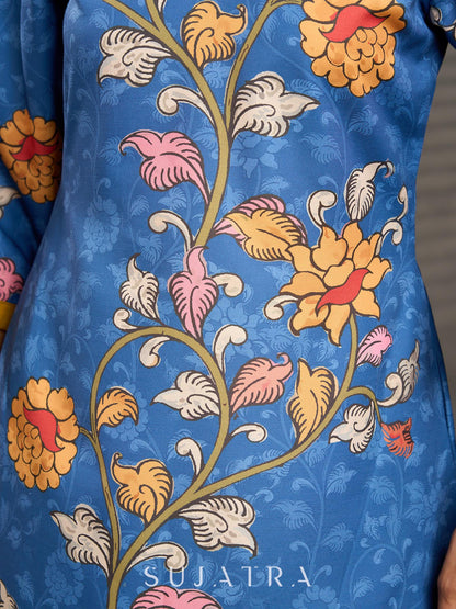 Indigo Kalamkari printed dress with vibrant red and mustard accents.