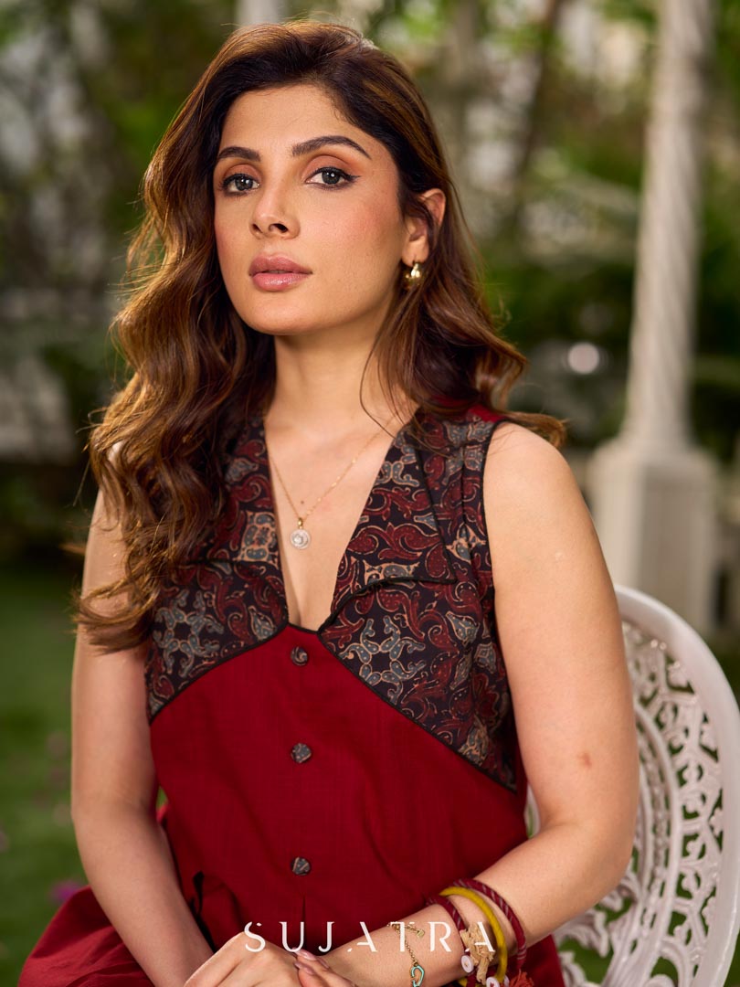 Statement sleeveless Ajrakh dress elevated with a folded collar and graceful maroon pleats.