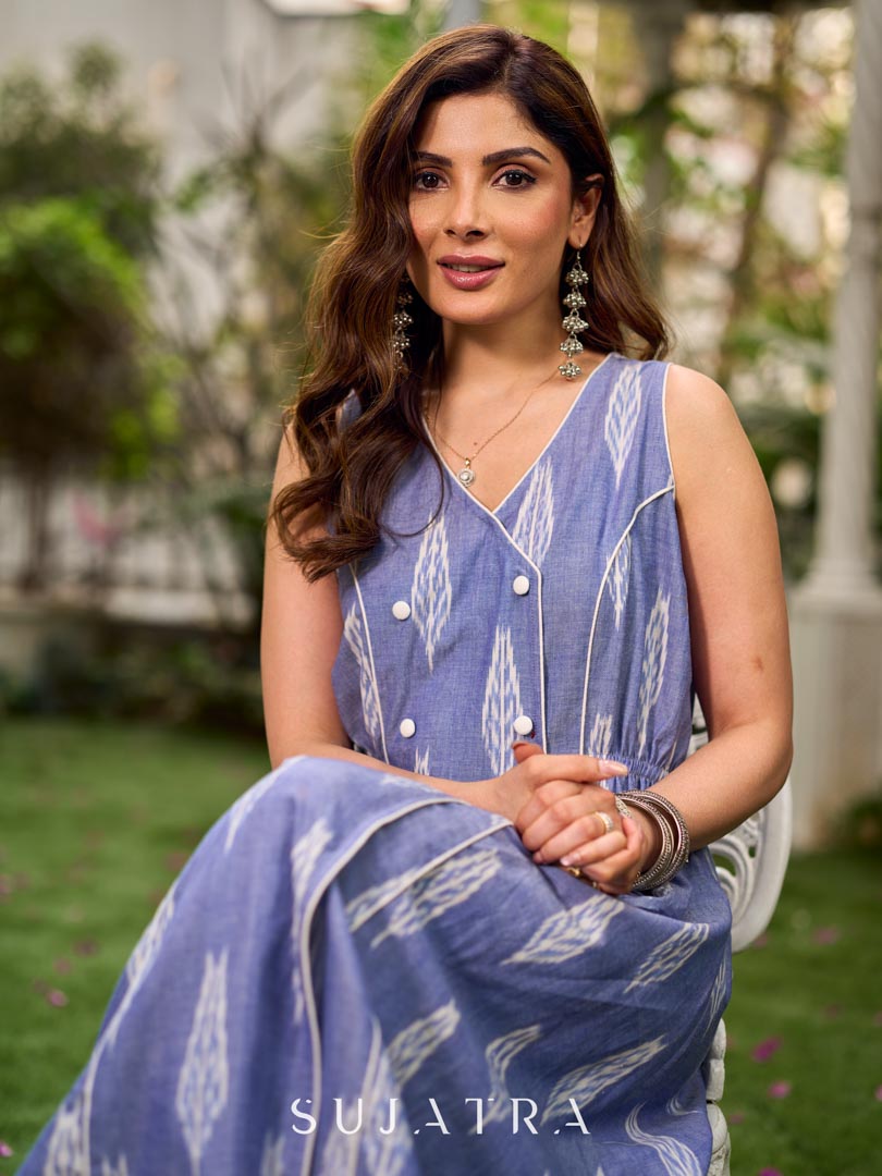 Graceful powder blue Ikat dress showcasing layered overlap details highlighted with white accents.