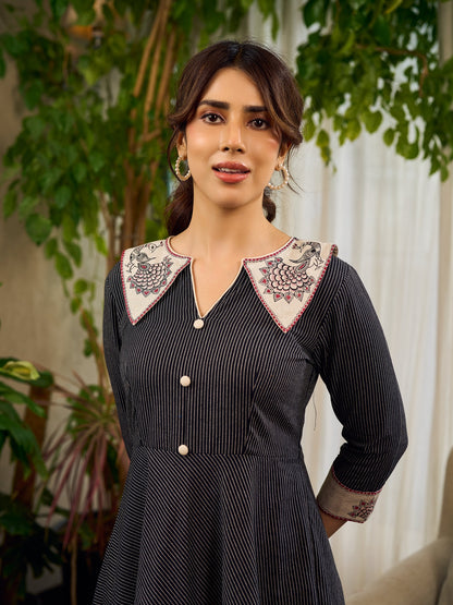 Timeless black stripes accented with exquisite hand-painted Madhubani on collars and cuffs
