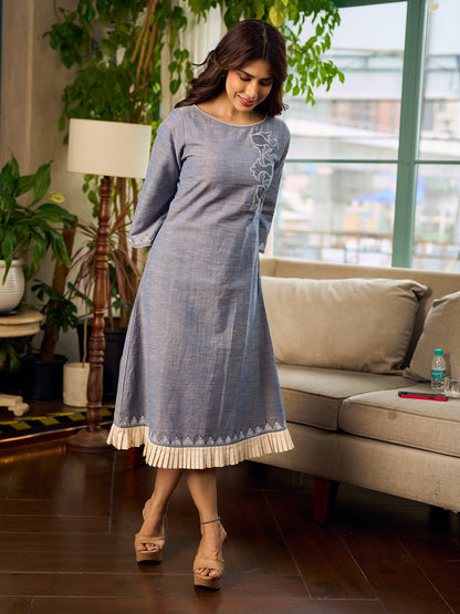 Two-tone handloom cotton dress with delicately painted Madhubani fish motifs and pleated hem.