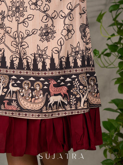 Beige traditional printed dress with rich maroon accents.