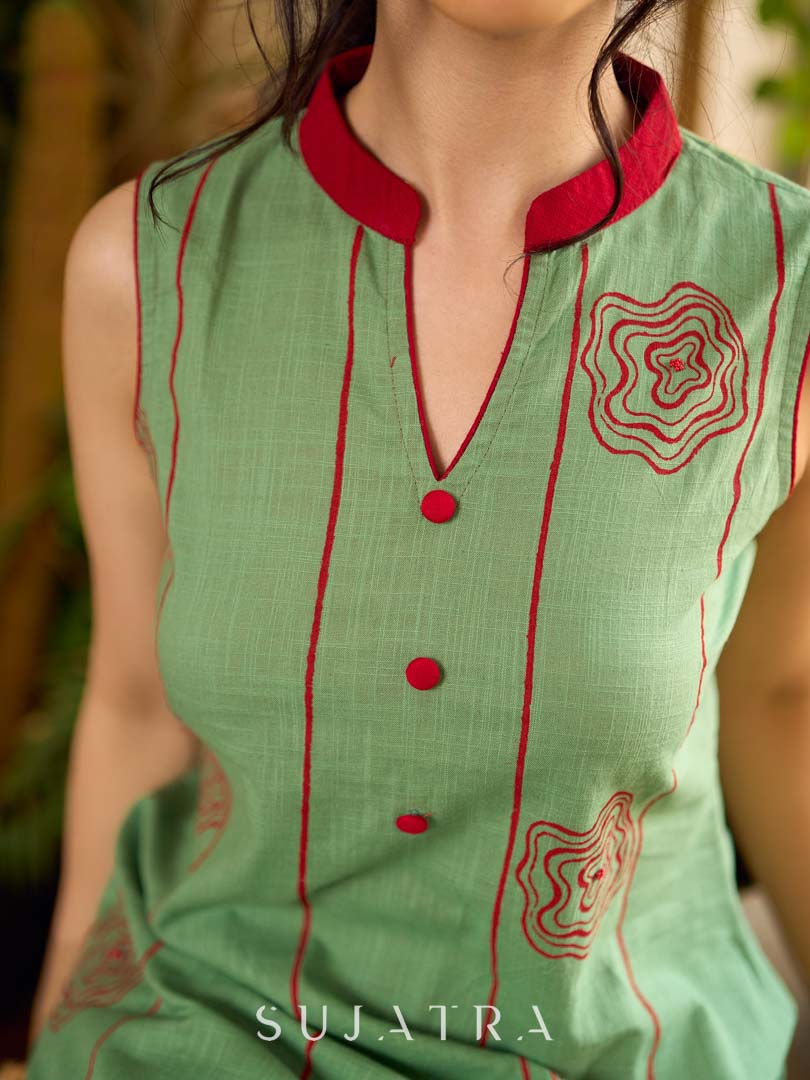 Pista sleeveless block printed dress with red abstract motif panels, a contrasting red collar, and accents for a fresh, artisanal, contemporary look.