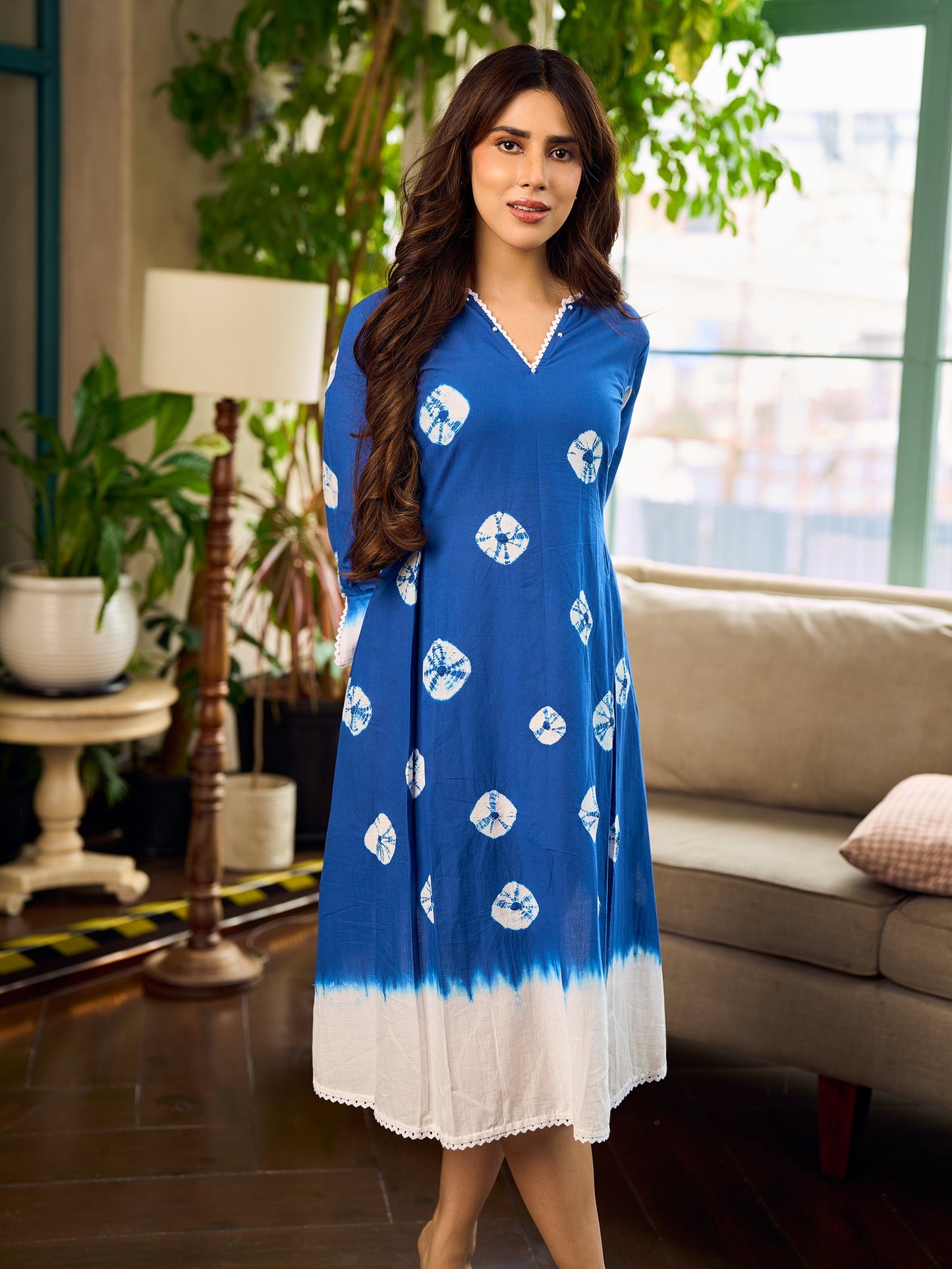 Refreshing cobalt blue shibori tie-dye dress with ivory accents and delicate lace-trimmed neckline.