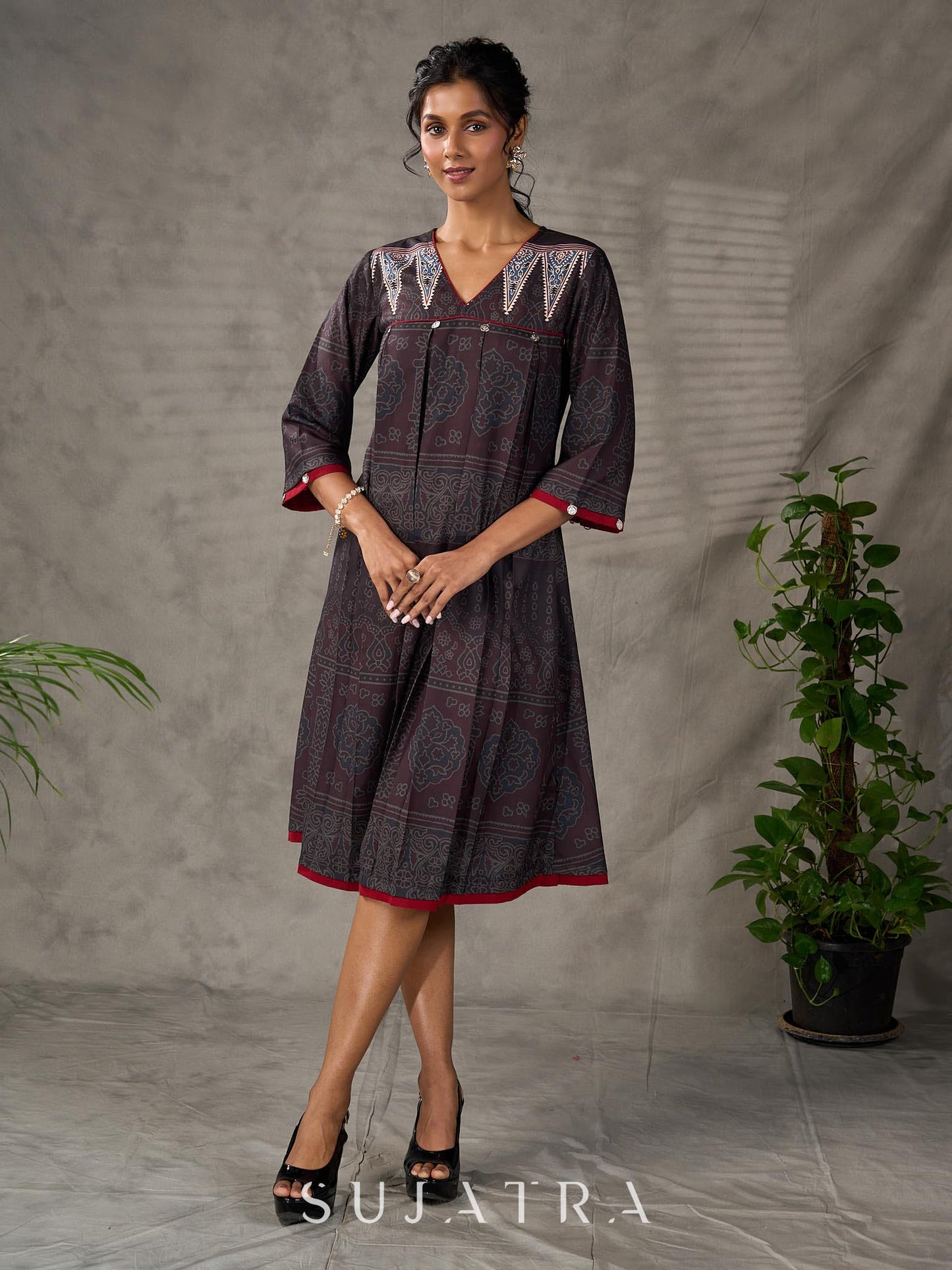 Black Ajrakh printed dress with pleats, maroon accents, and silver embellishments.