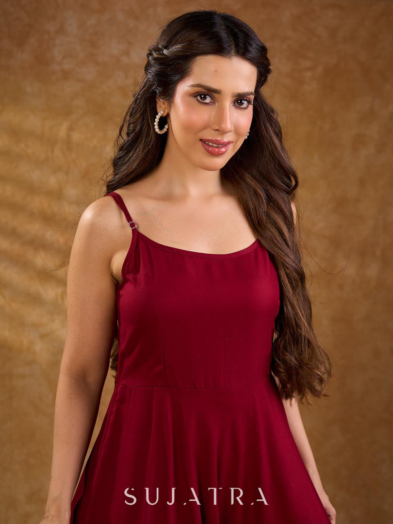 Deep maroon rayon strap dress with a fluid bias-cut silhouette, offering a soft drape, flattering shape, and an elegant, understated look for effortless everyday styling.