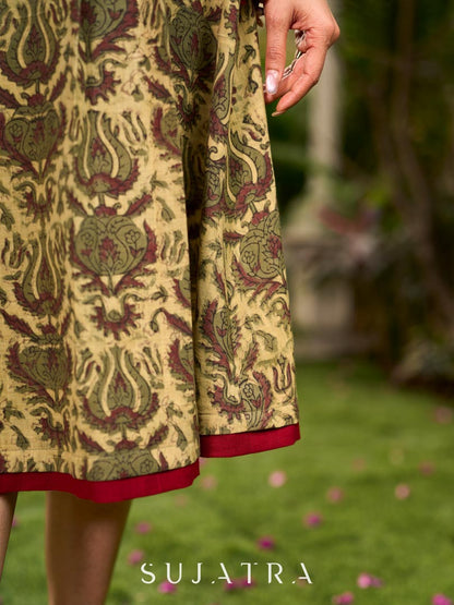 Graceful natural-printed halter dress elevated with subtle maroon highlights.