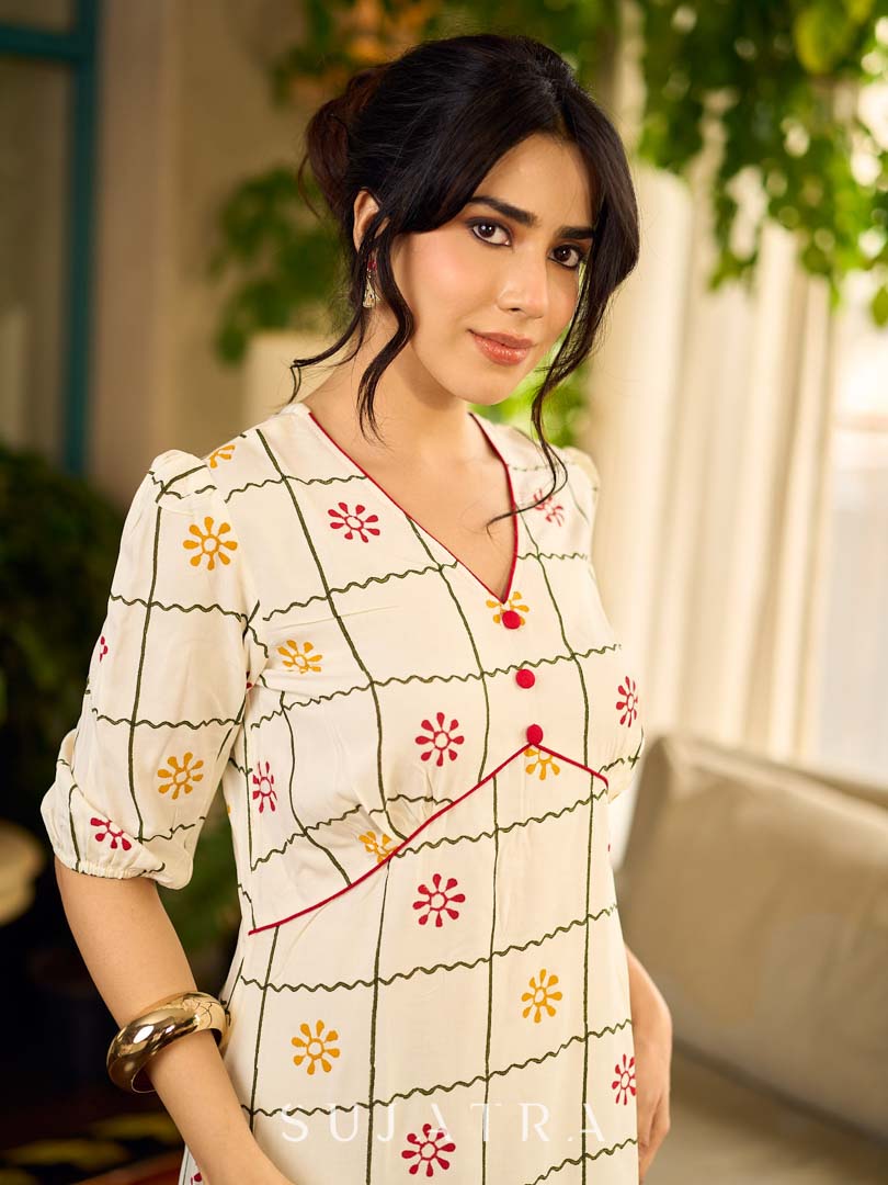 Soft off-white block printed rayon dress with intricate all-over hand block printed checks and florals, a gently gathered yoke, and rich red accents for a refined, elegant everyday look.