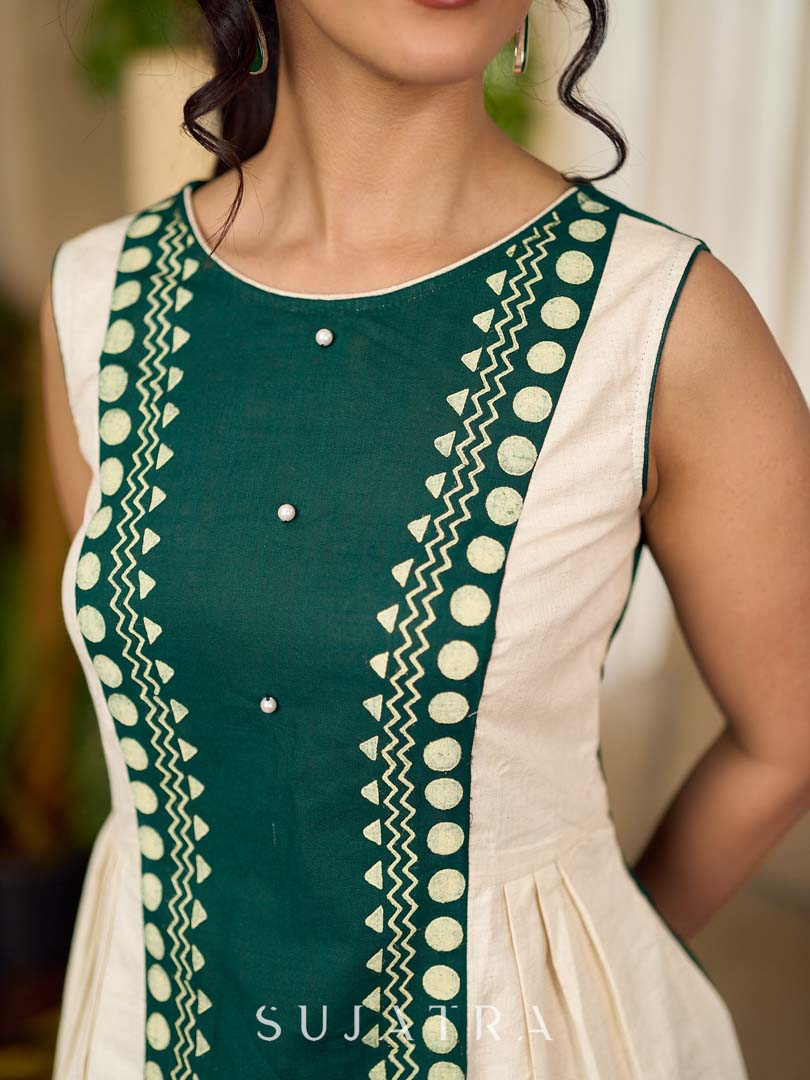 Bottle green and off-white hand block printed sleeveless dress with a block printed geometric panel, pearl embellishments, and refined accents for a contemporary artisanal look.