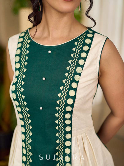 Bottle green and off-white hand block printed sleeveless dress with a block printed geometric panel, pearl embellishments, and refined accents for a contemporary artisanal look.