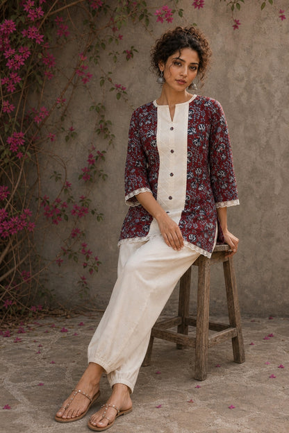 Deep red Jaipur floral printed top featuring maroon pintuck yoke, off-white panel, and scalloped lace detailing.