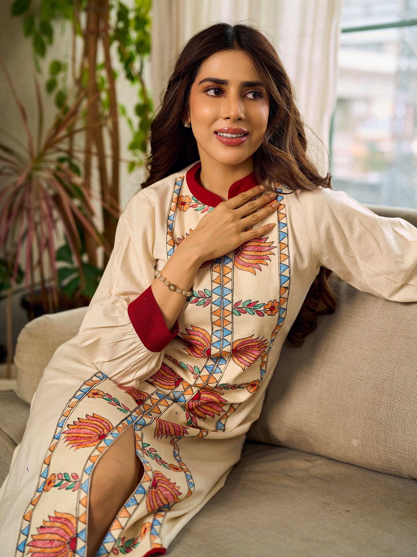 Artisan-crafted off-white Madhubani dress with beautiful hand-painted motifs and trim.