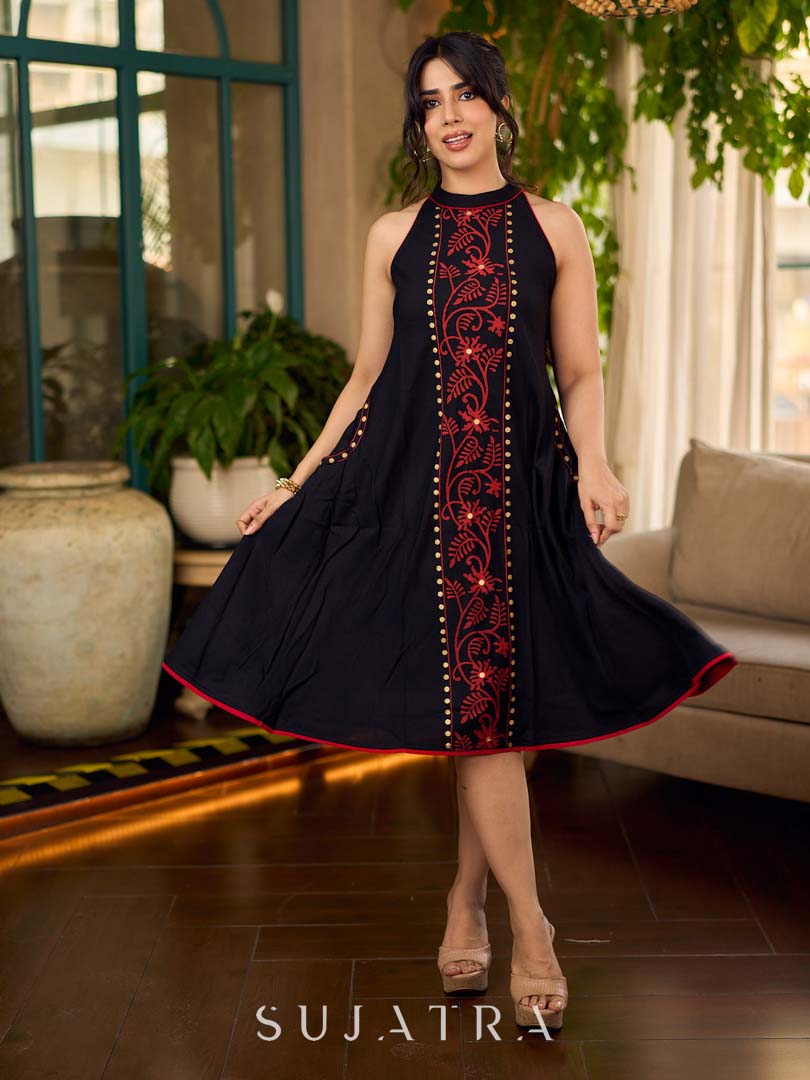 Black bias-cut block print halter dress with a red jaal hand block printed front panel, golden print detailing, and red accents for a striking, elegant statement look.