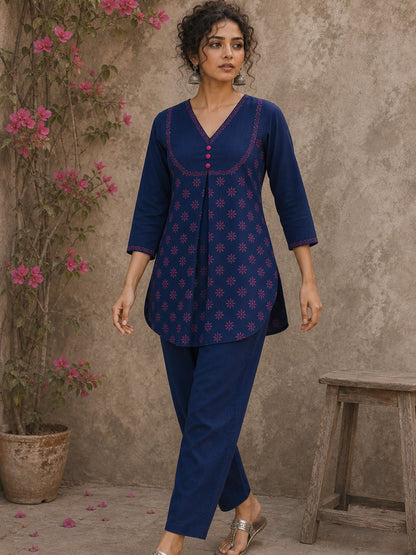 Vibrant navy blue and pink hand block print top features bell sleeves, floral detailing, and rich navy hues for effortless everyday charm.