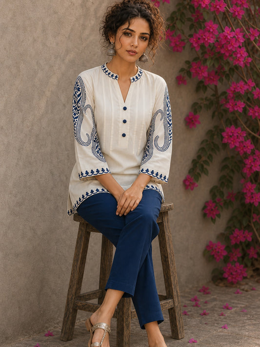 Elegant ivory hand block print top featuring intricate navy blue paisley sleeves, refined contrast detailing, and graceful pintucks, blending artisanal craftsmanship with timeless everyday sophistication.