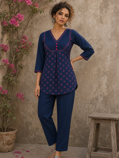 Vibrant navy blue and pink hand block print top features bell sleeves, floral detailing, and rich navy hues for effortless everyday charm.