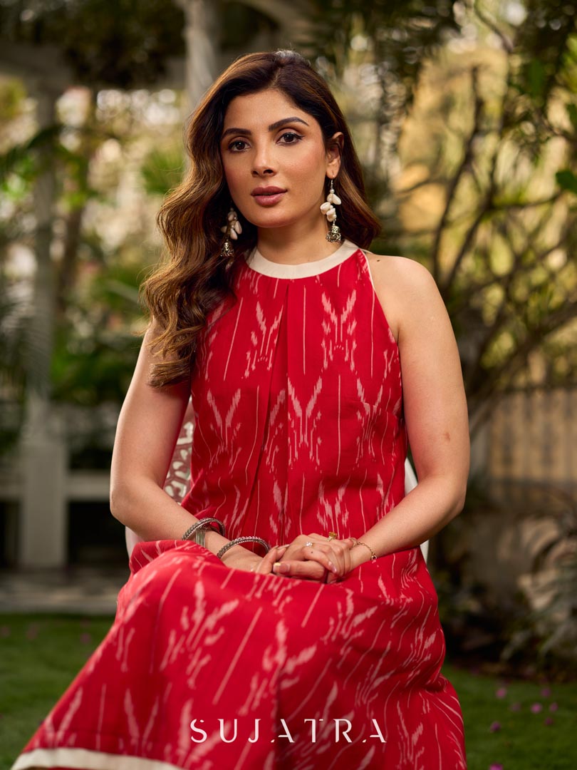 Statement red Ikat halter-neck dress accented in white, designed with a box pleat at the neckline for fluid drape.