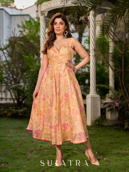 Effortless sunshine yellow floral dress designed with a delicate neckline, gathered straps, and a breezy, flowy form.