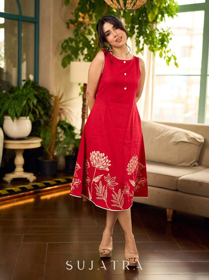 Vibrant red sleeveless dress with a bold off-white floral hand block print at the hem and clean off-white edging for a striking, handcrafted-inspired finish.