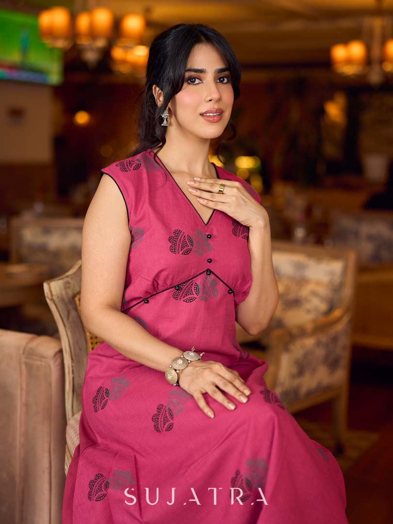 Rich wine drop-shoulder dress with black and grey hand block printed floral motifs, a softly gathered yoke, black pearl embellishments, and bold black accents for a striking artisanal look.