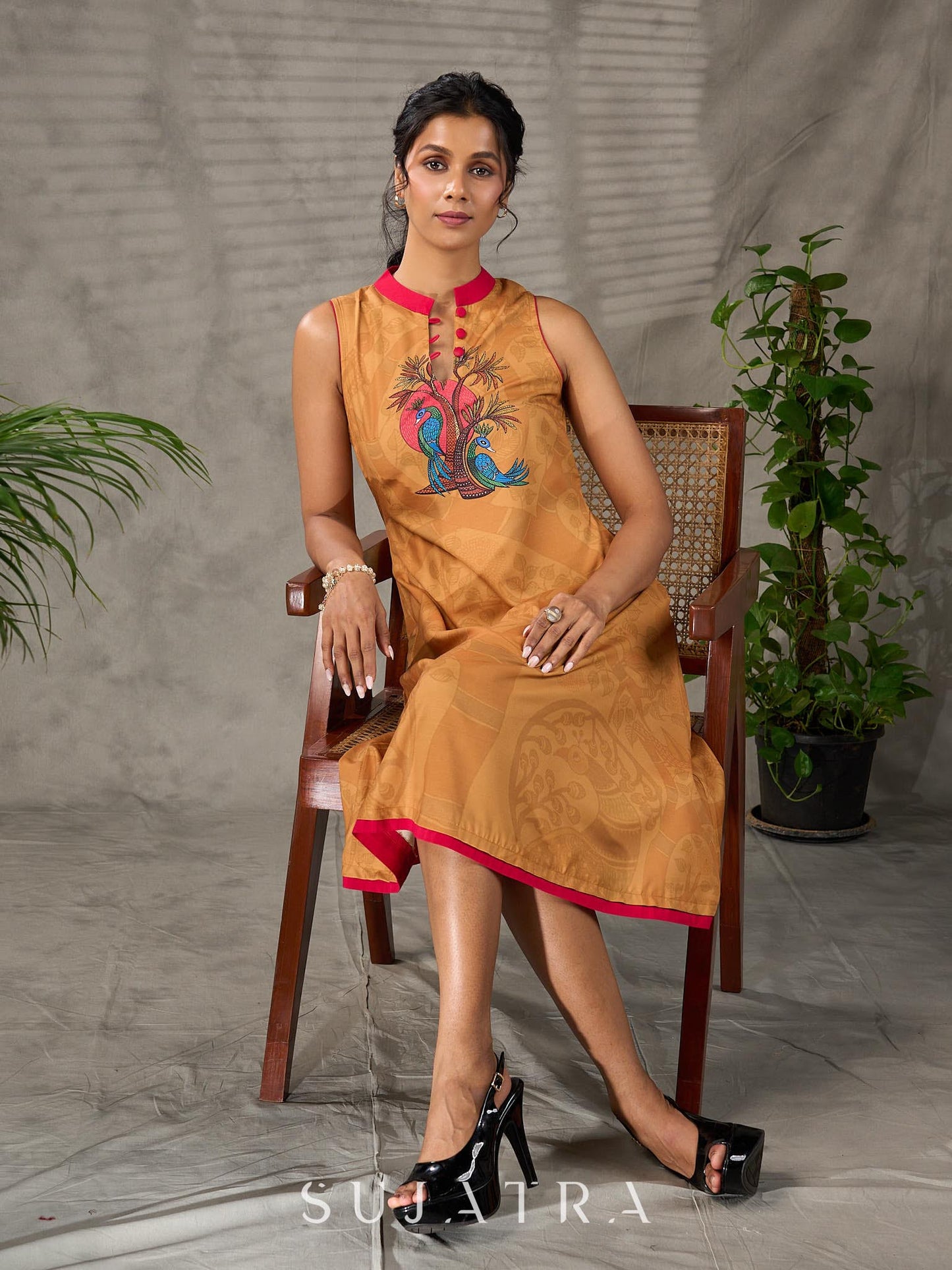 Mustard Gond printed mandarin collar dress with vibrant pink accents.
