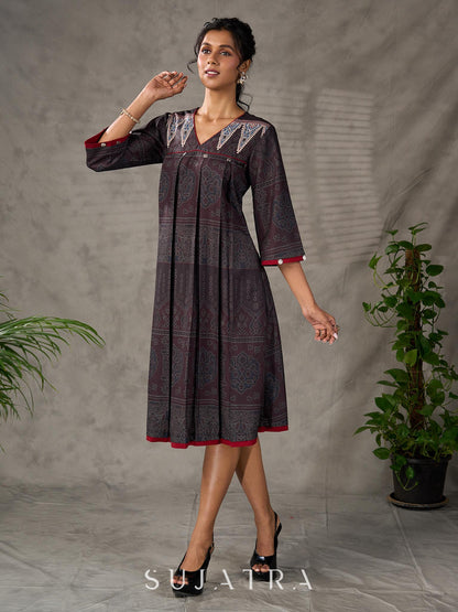 Black Ajrakh printed dress with pleats, maroon accents, and silver embellishments.