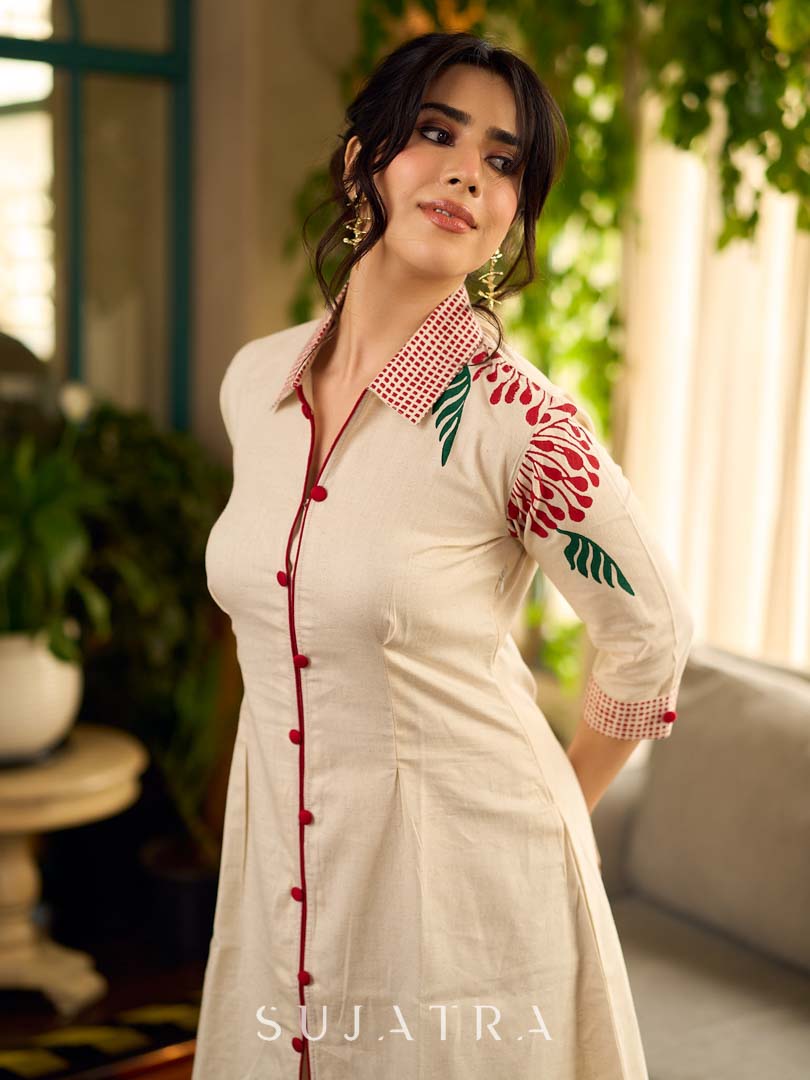 Off-white dandelion pleated shirt dress featuring dandelion placement block prints, checkered block-printed collar and cuffs, and red accents for a fresh, artisanal everyday look.
