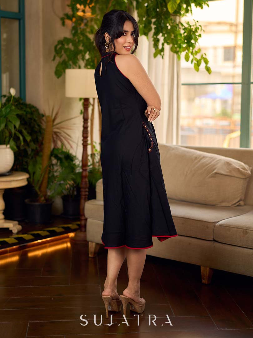 Black bias-cut block print halter dress with a red jaal hand block printed front panel, golden print detailing, and red accents for a striking, elegant statement look.