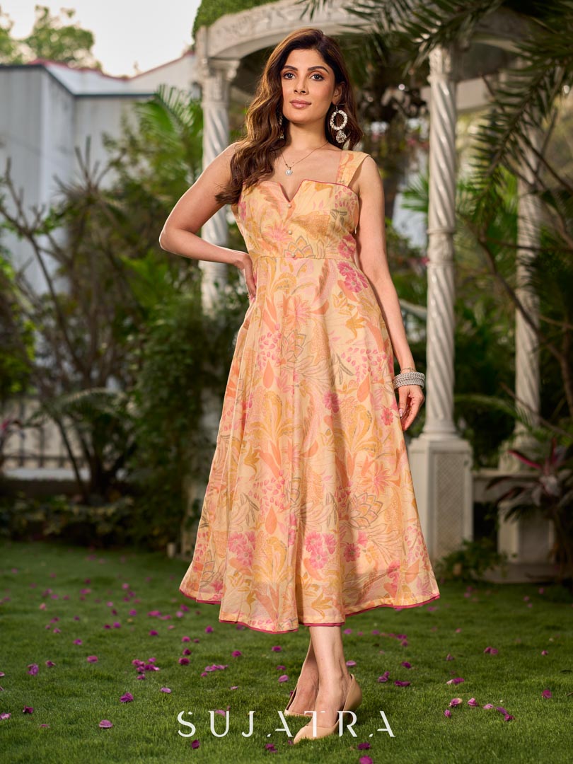 Effortless sunshine yellow floral dress designed with a delicate neckline, gathered straps, and a breezy, flowy form.