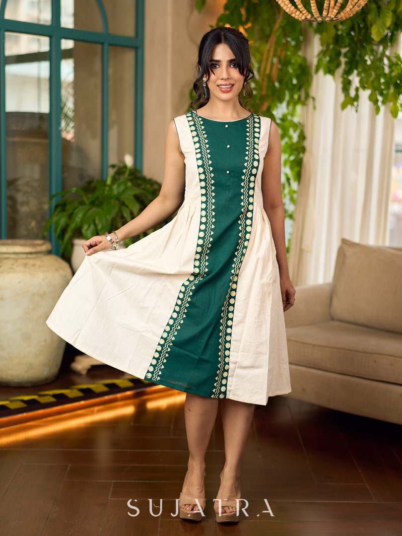 Bottle green and off-white hand block printed sleeveless dress with a block printed geometric panel, pearl embellishments, and refined accents for a contemporary artisanal look.