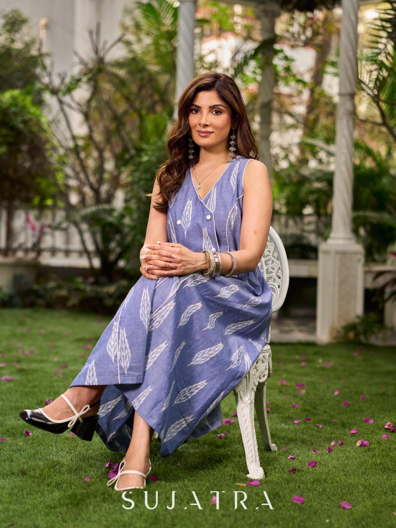 Graceful powder blue Ikat dress showcasing layered overlap details highlighted with white accents.