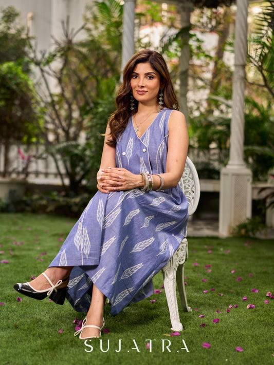 Graceful powder blue Ikat dress showcasing layered overlap details highlighted with white accents.