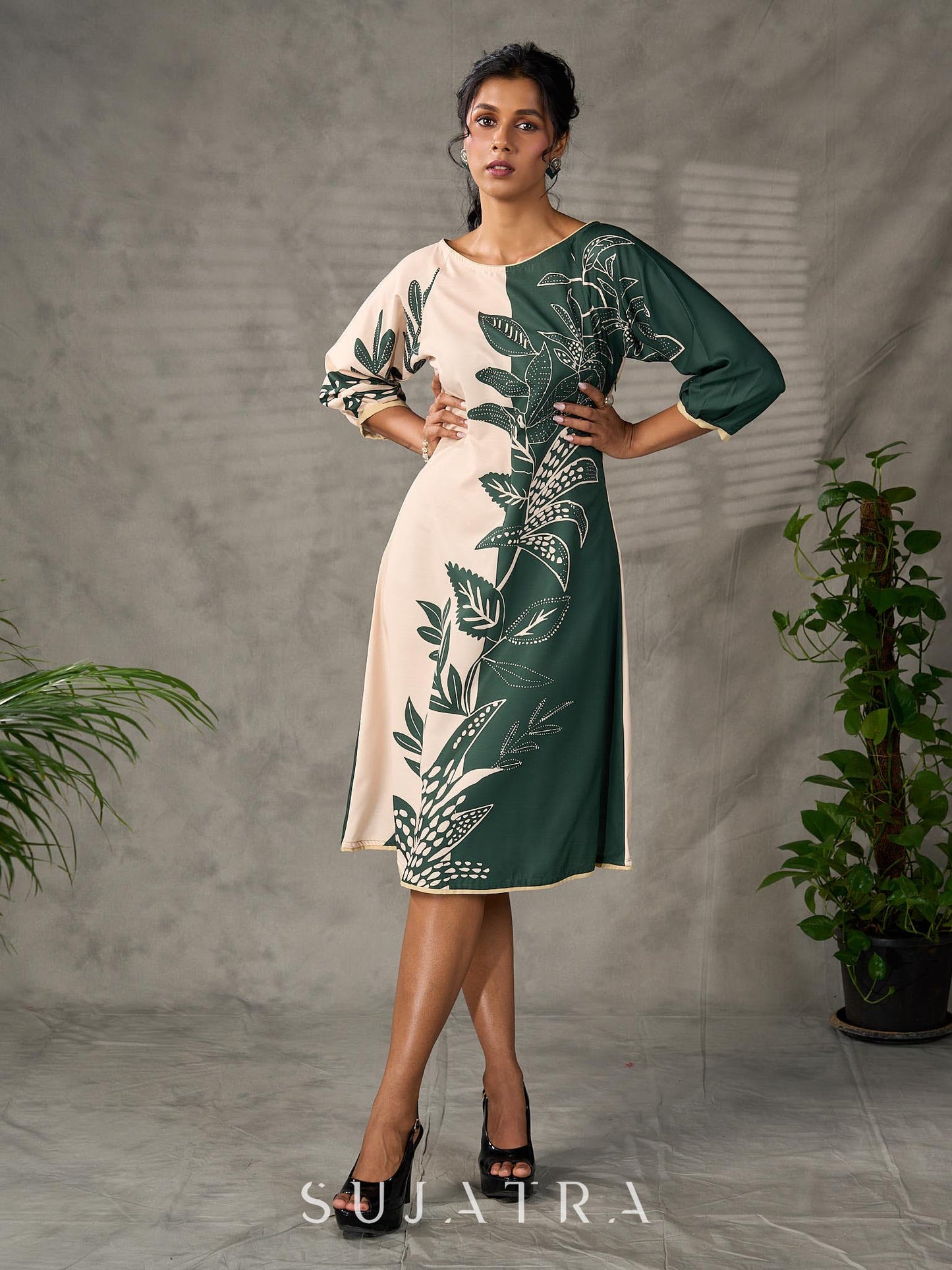 Bottle green and beige half and half dress with raglan sleeves and transitioning floral motifs.