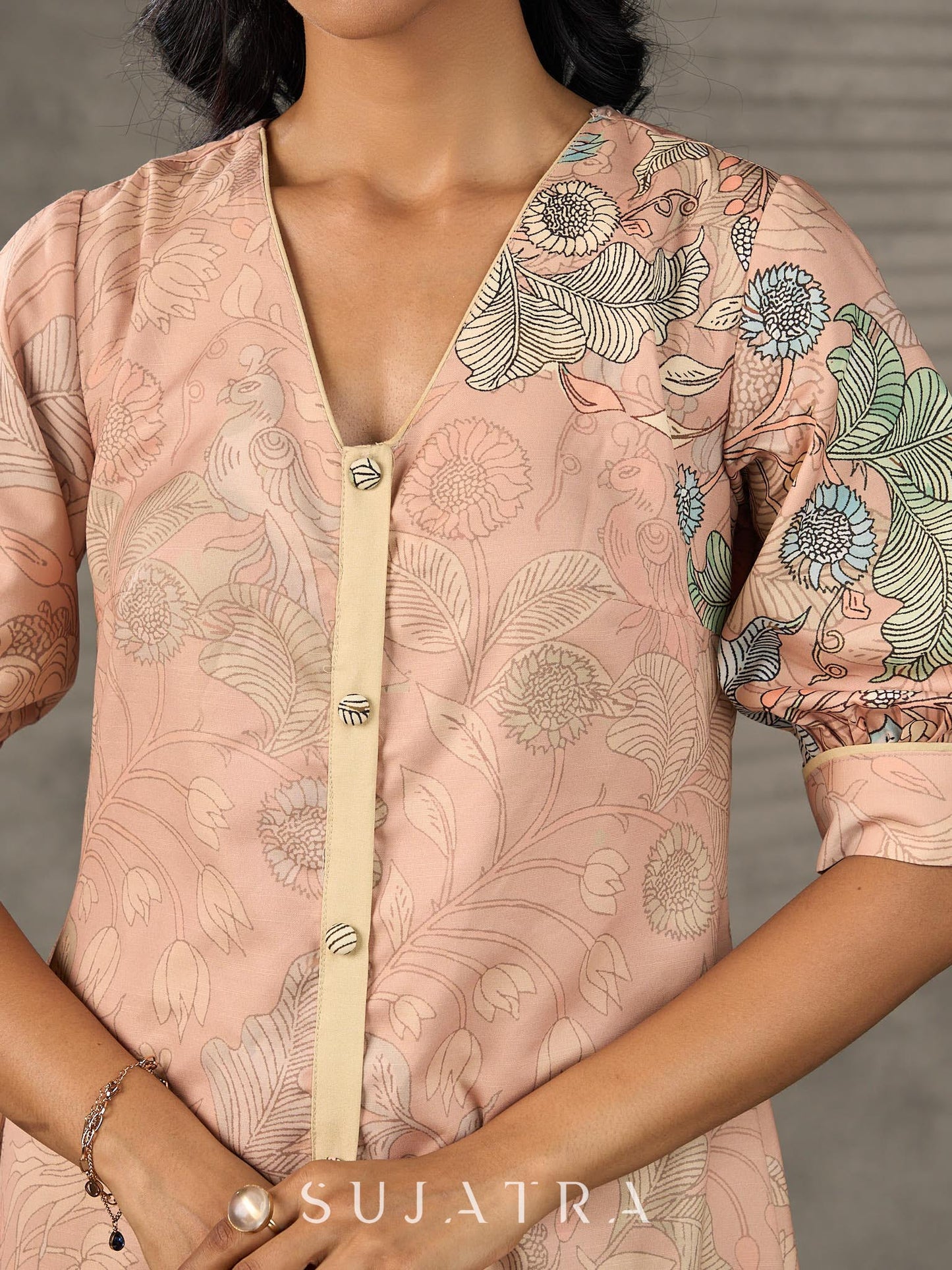 Peach Kalamkari-inspired shirt dress with soft beige accents.