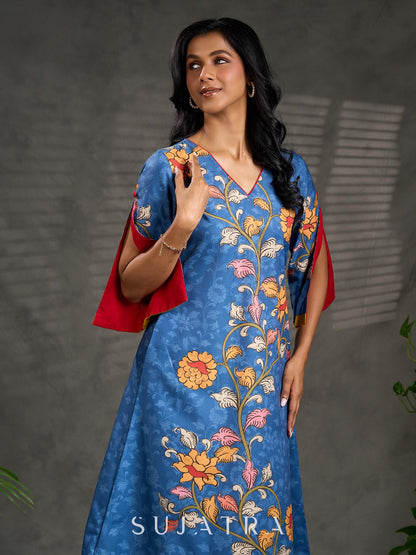 Indigo Kalamkari printed dress with vibrant red and mustard accents.