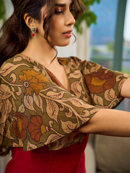 Elegant maroon dress featuring an attached artisan Kalamkari shoulder cape.