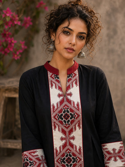 Heritage-inspired black top showcasing handcrafted block print panels, elegant maroon trims, and timeless artistry for versatile modern styling.