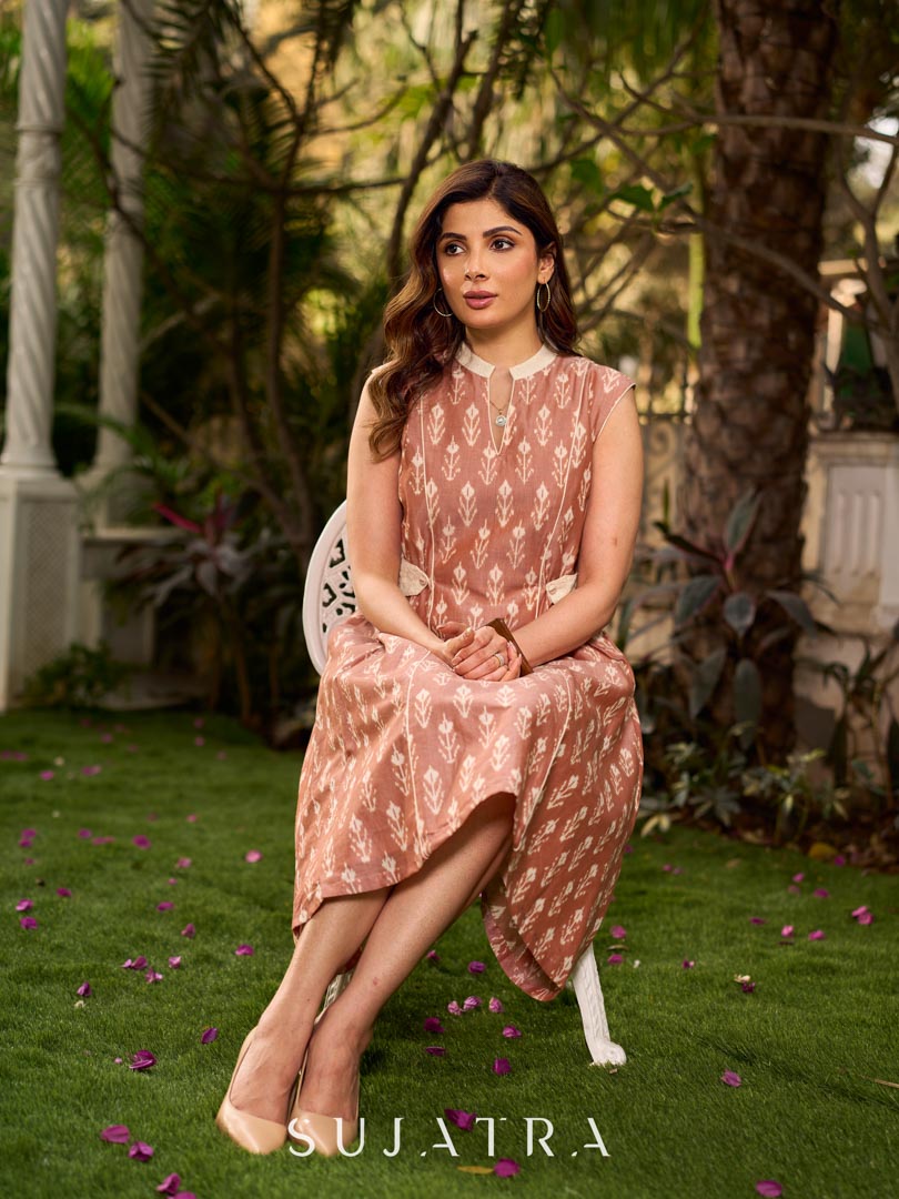 Chic champagne beige Ikat dress elevated with Hakoba accents, a relaxed drop-shoulder fit, mandarin neckline, and fluid side gathers detailed with Hakoba flaps.