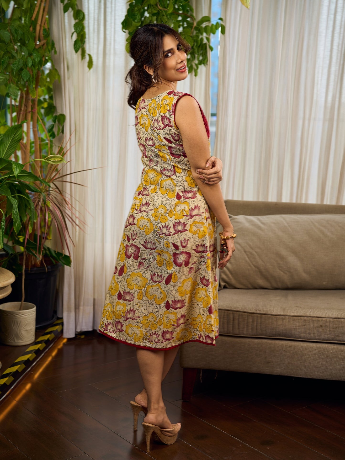 Elegant cream and maroon Madhubani dress featuring sophisticated wavy pintuck flap detailing.