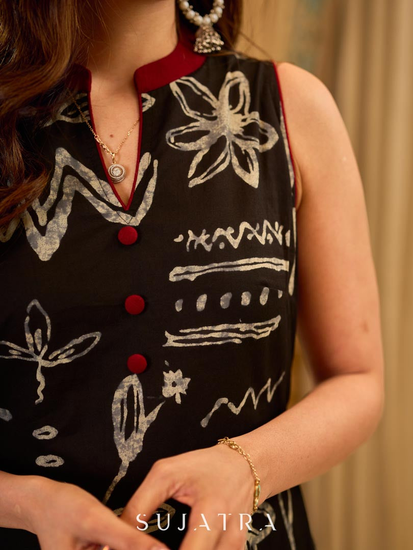 Statement black abstract-printed dress finished with maroon pleats for added depth and movement