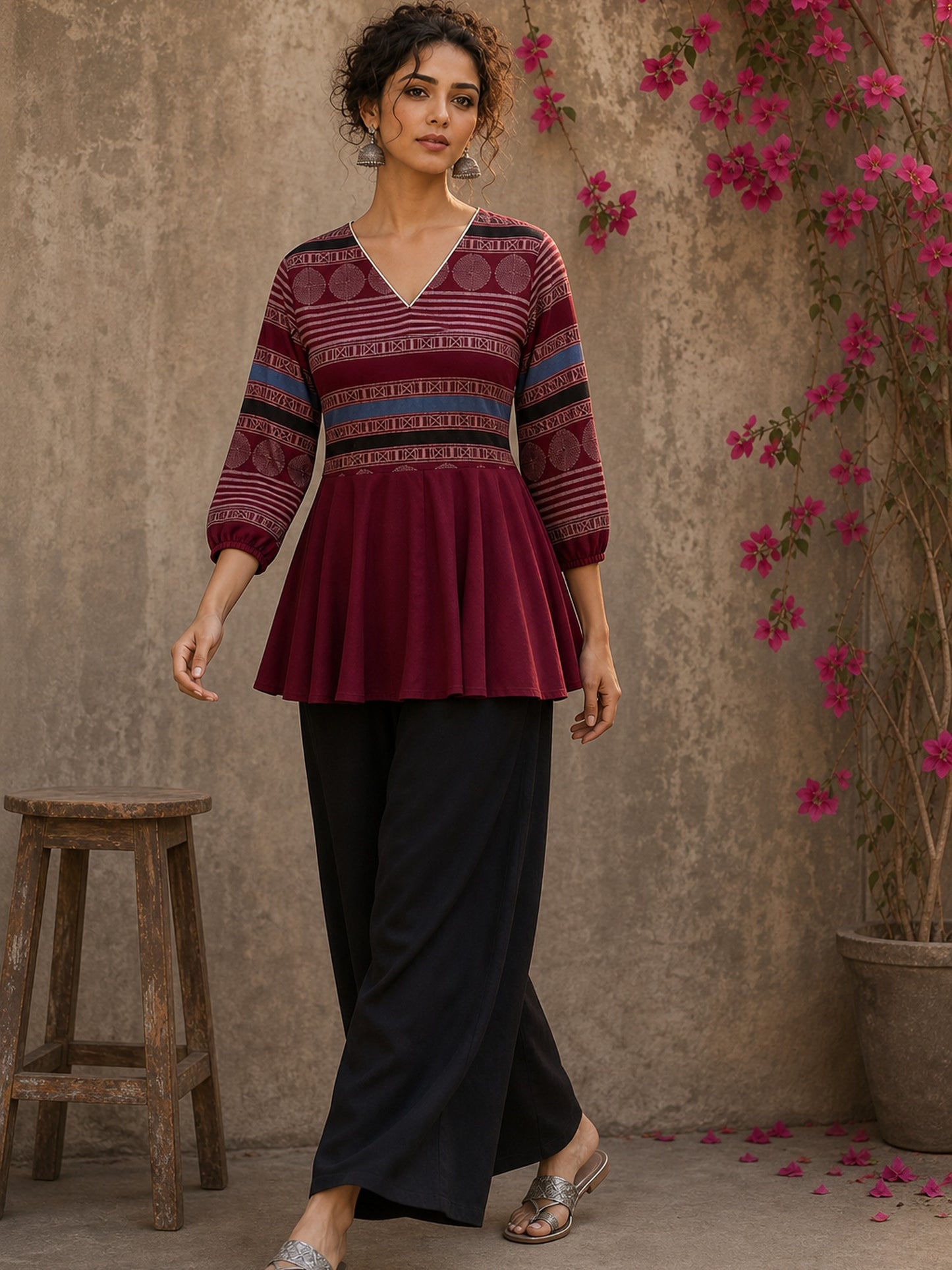 Bold and playful maroon hand block print peplum top with beige geometric motifs and subtle blue accents for effortlessly chic everyday style.