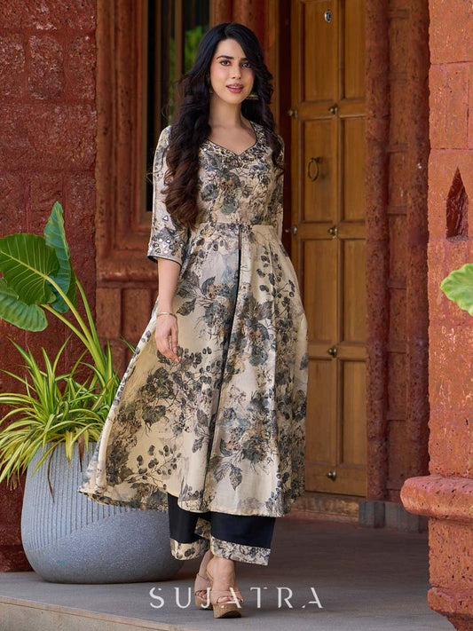 Elegant black–white floral kurta featuring a graceful bias silhouette, intricate mirror embroidery on the neck and sleeves, and a sweetheart neckline.