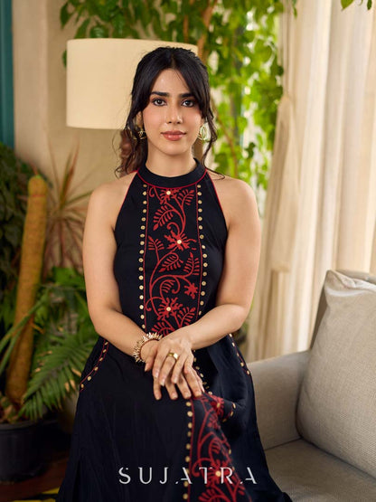 Black bias-cut block print halter dress with a red jaal hand block printed front panel, golden print detailing, and red accents for a striking, elegant statement look.