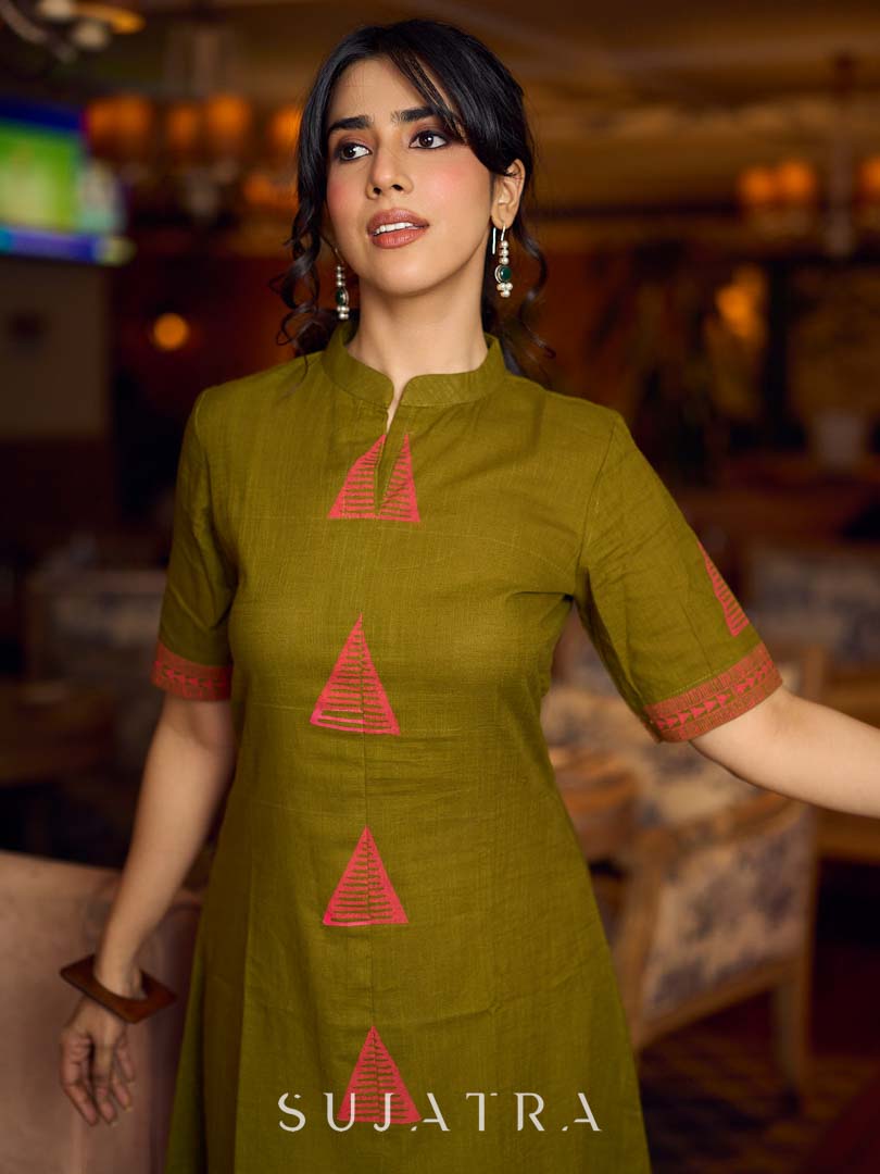Gorgeous olive dress with pink abstract triangle hand block prints placed at the centre, sleeves, and back, featuring a mandarin collar and half sleeves for a refined, contemporary look.