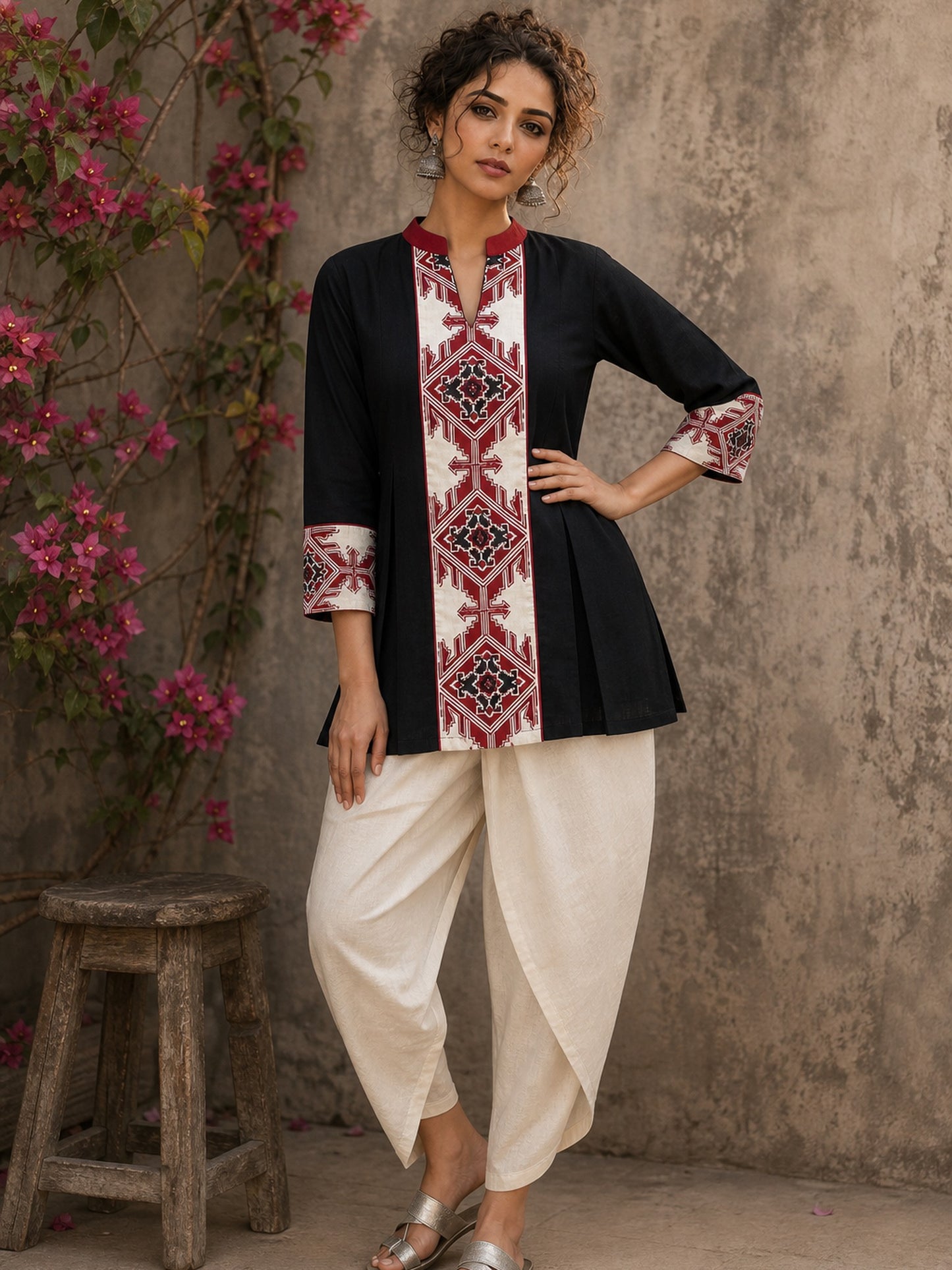 Heritage-inspired black top showcasing handcrafted block print panels, elegant maroon trims, and timeless artistry for versatile modern styling.