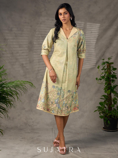 Soft green Kalamkari printed collared dress with centre pleat detailing.